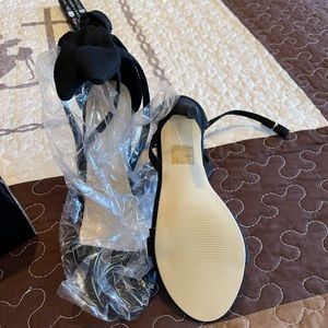 Brand new heels with bow tie on back